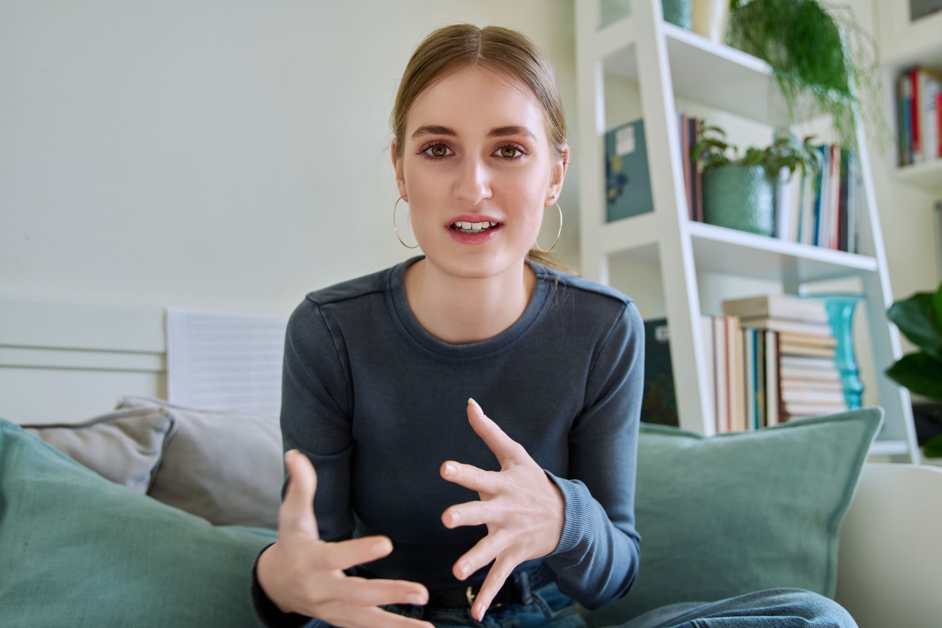 Web camera view of teenage girl talking looking in camera, online meeting, video call